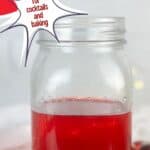 A photo of a jar of cranberry simple syrup set into a decorative text box that reads cranberry simple syrup for cocktails and baking