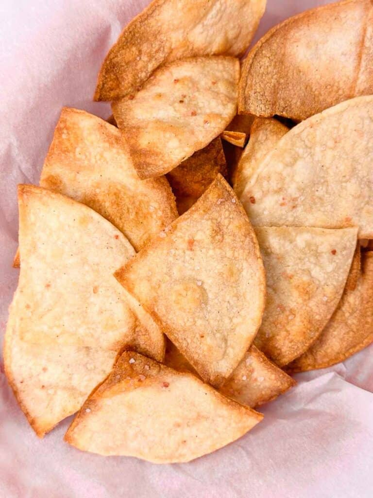 Homemade corn tortilla chips baked in the oven ready to serve.