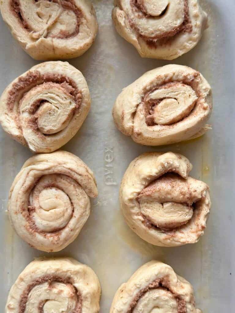 Baking dish with unbaked cinnamon buns.