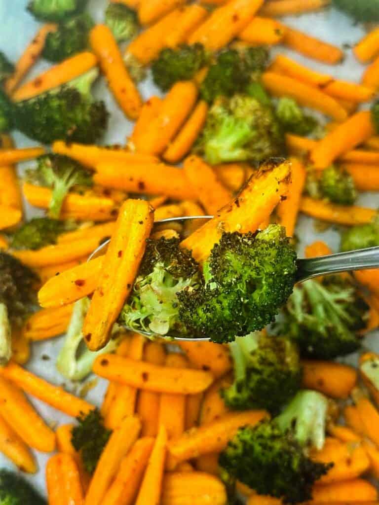 Spoonful of broccoli and carrots.