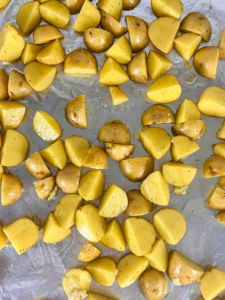 Quarted potatoes ready to bake.