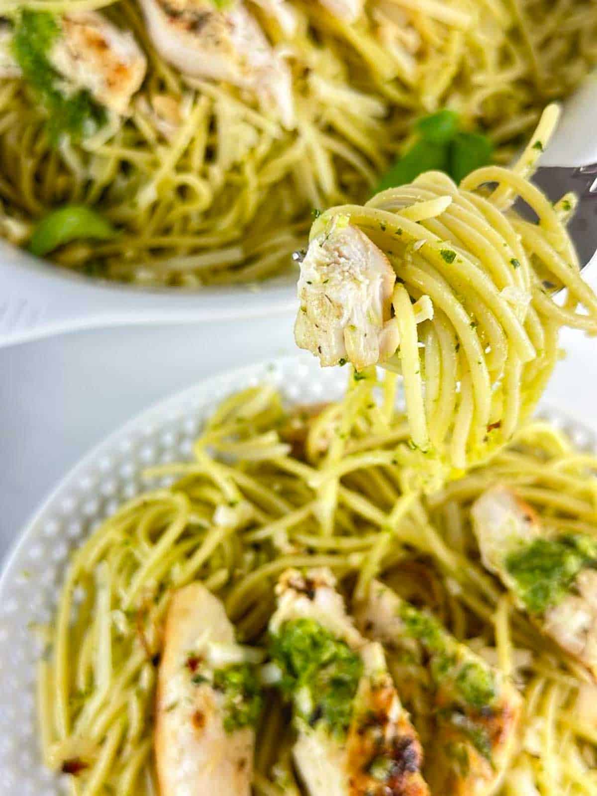 a forkful of chicken spaghetti pesto