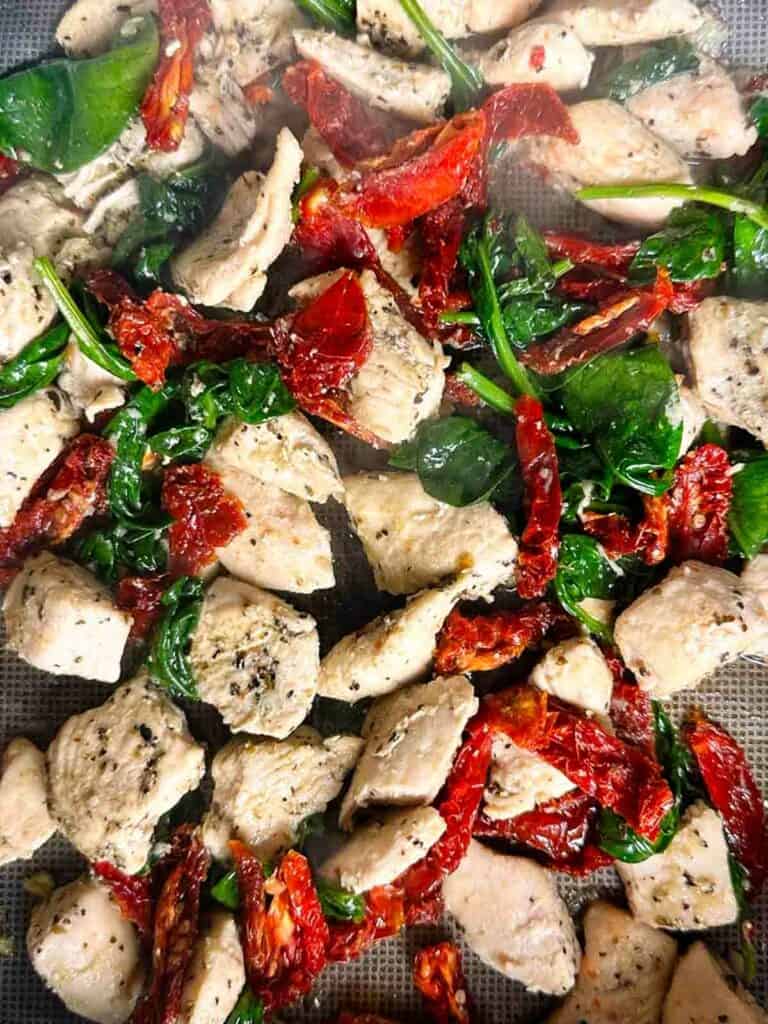 Add the sun dried tomatoes to the Marry Me Chicken skillet