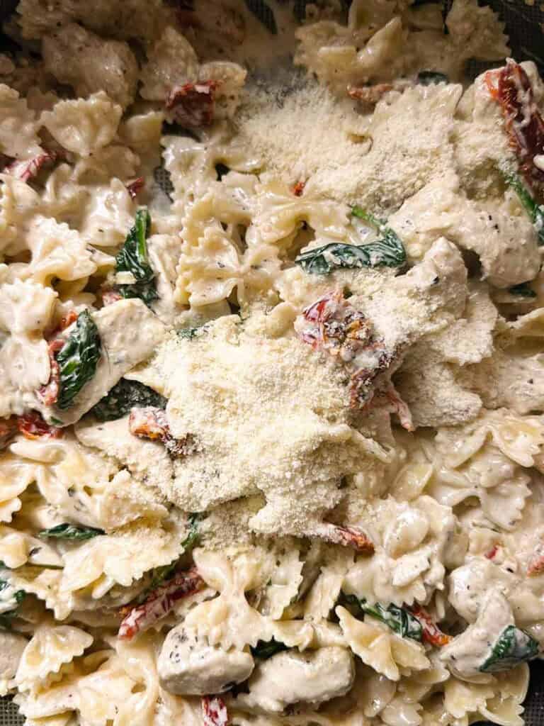 Add the parmesan cheese to the Marry Me chicken pasta