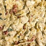 a photo of a skillet of marry me chicken pasta with a decorative text box that reads marry me chicken pasta