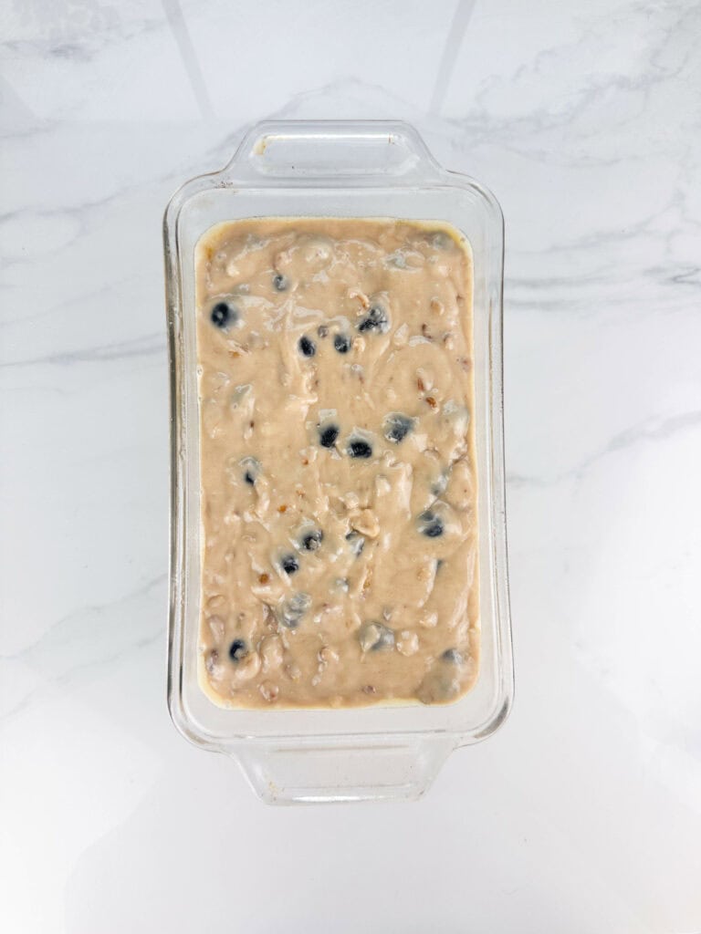 Blueberry banana nut bread batter in a loaf pan