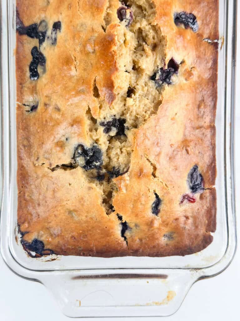 Blueberry banana nut bread in a glass loaf pan