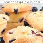 Buttermilk blueberry muffins on a wooden cutting board. Text reads: buttermilk blueberry muffins, seasonedsprinkles.com