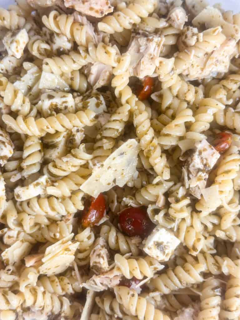 Close up of chicken pesto pasta salad.