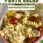 Bowl of chicken pesto pasta salad. Text reads: chicken pesto pasta salad, seasonedsprinkles.com