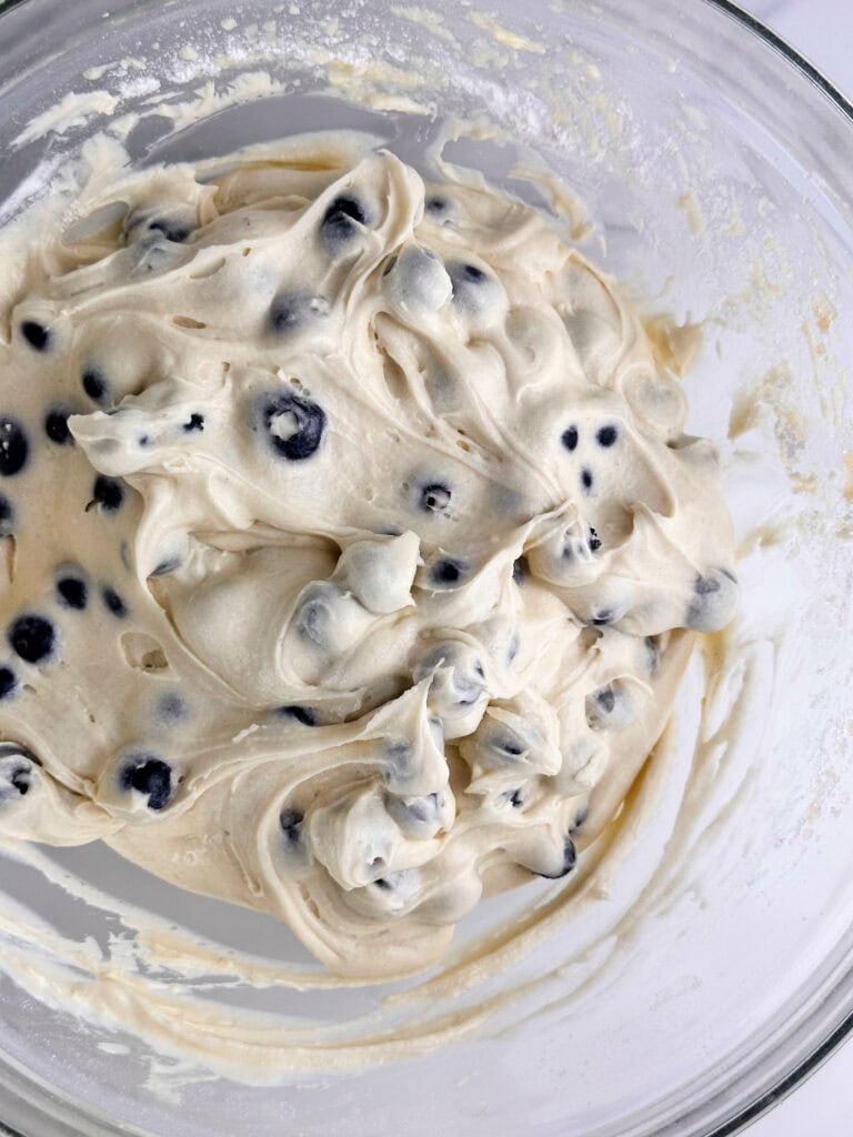 Buttermilk blueberry muffin batter with folded in blueberries.