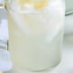Image of a mason jar glass of homemade lemonade. Text reads homemade lemonade recipe, seasonedsprinkles.com.