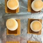 Fully bake smores with golden brown marshmallows. Text reads sheet pan smores in the oven, seasonedsprinkles.com