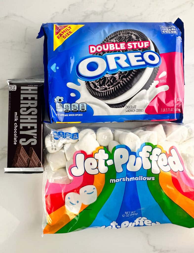 Ingredients for smore oreos: Oreos, Heshey's bars, and marshmallows.