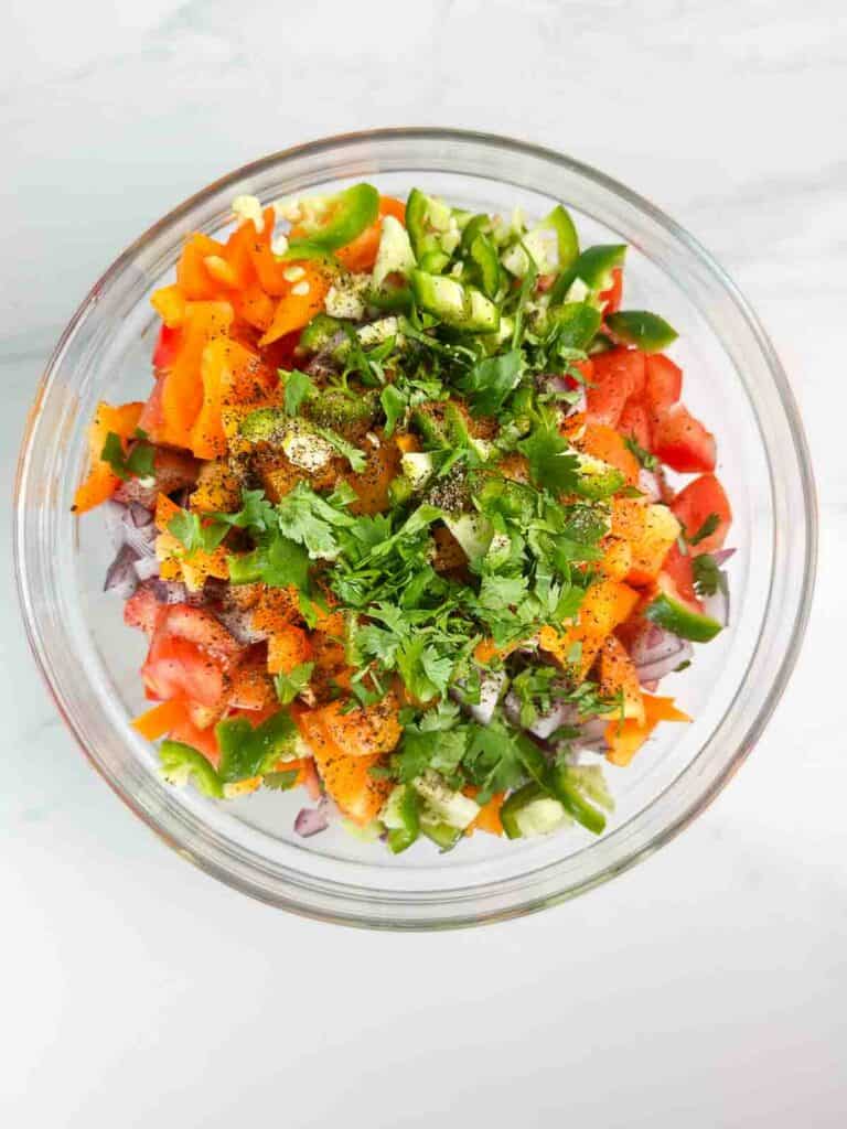 All the ingredients for black bean and corn salsa in a bowl