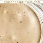 Caesar salad dressing in a mason jar. Text reads: caesar dressing recipe, seasonedsprinkles.com