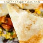 a photo of a piece of cheese quesadilla cut into a wedge collaged into a decorative text box reading cheese quesadilla seasonedsprinkles.com