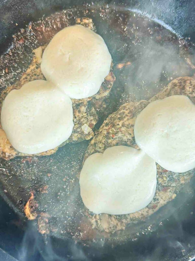 Chicken topped with mozzarella cheese.