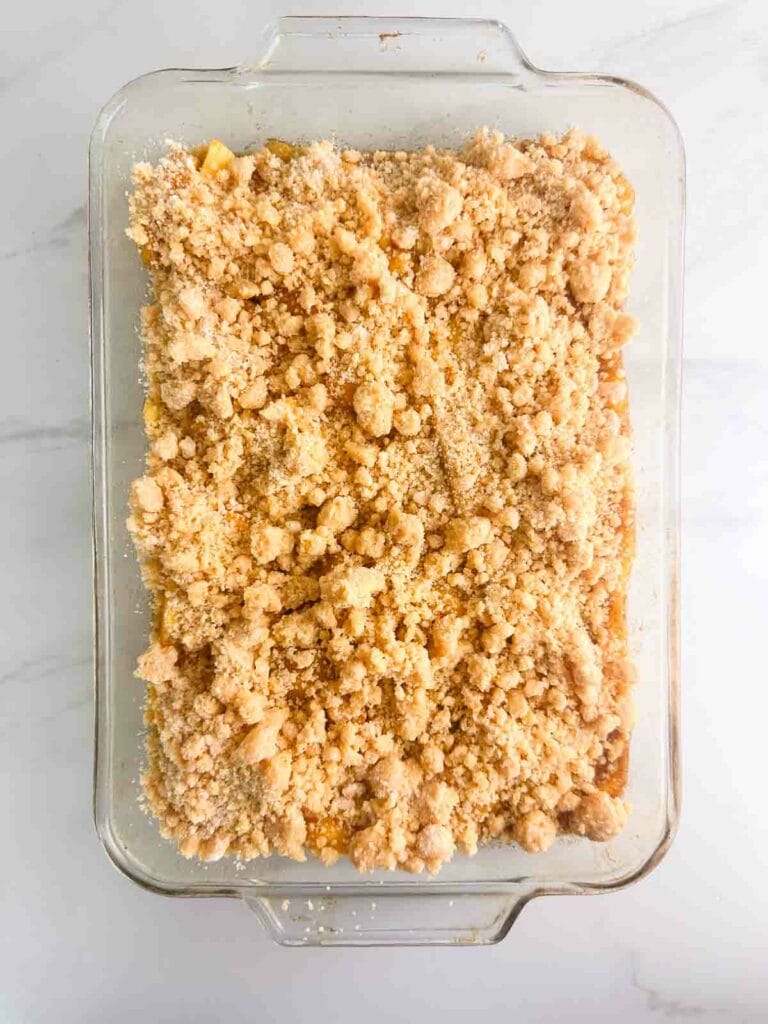 Peach cobbler with cake mix before baking.