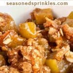 Close up of apple crumble. Text reads: apple crumble, seasonedsprinkles.com