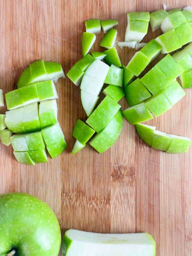Slice apples into smaller cubes.