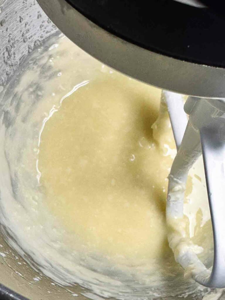 Butter and oil mixed in the bowl of a mixer.