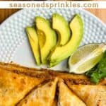 Plate of chicken quesadillas with avocado and lime. Text reads: ground chicken quesadillas, seasonedsprinkles.com