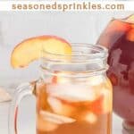 Mason jar of peach iced tea. Text reads: peach iced tea, seasonsedsprinkles.com
