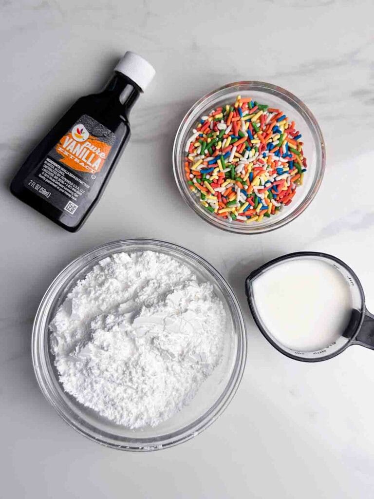 Ingredients for Homemade Strawberry Pop Tarts Recipe Icing: Powdered Sugar, Milk, Vanilla, Sprinkles