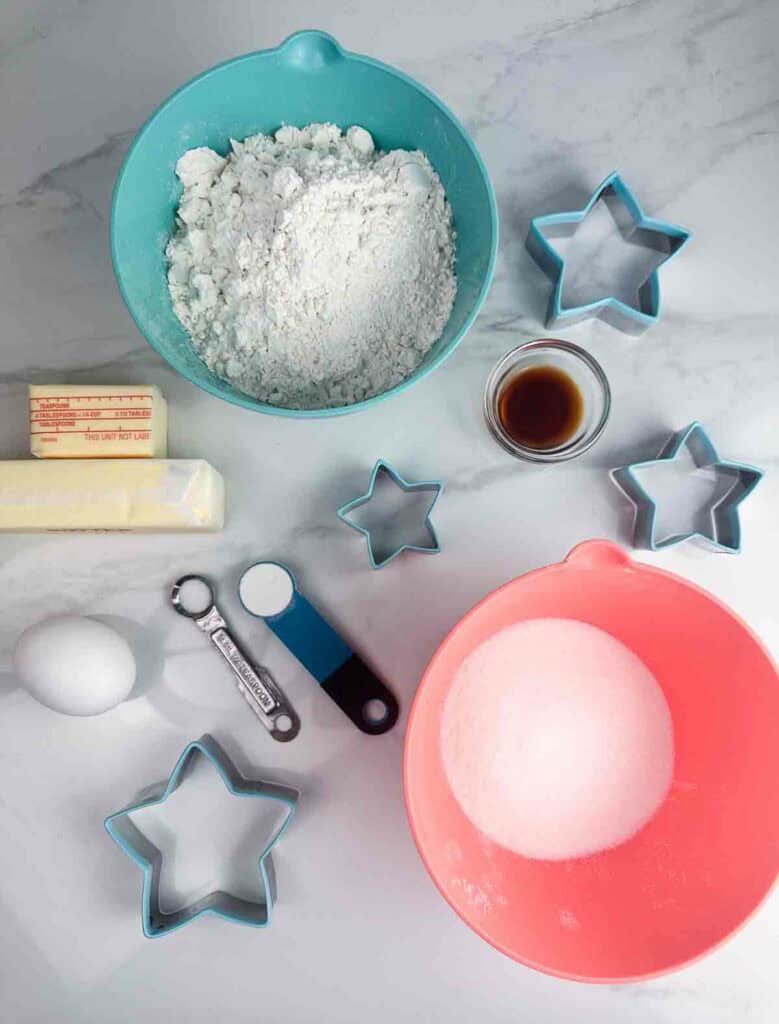 Ingredients for Showgirl star sugar cookies: flour, butter, vanilla, egg, salt, baking powder, and sugar.