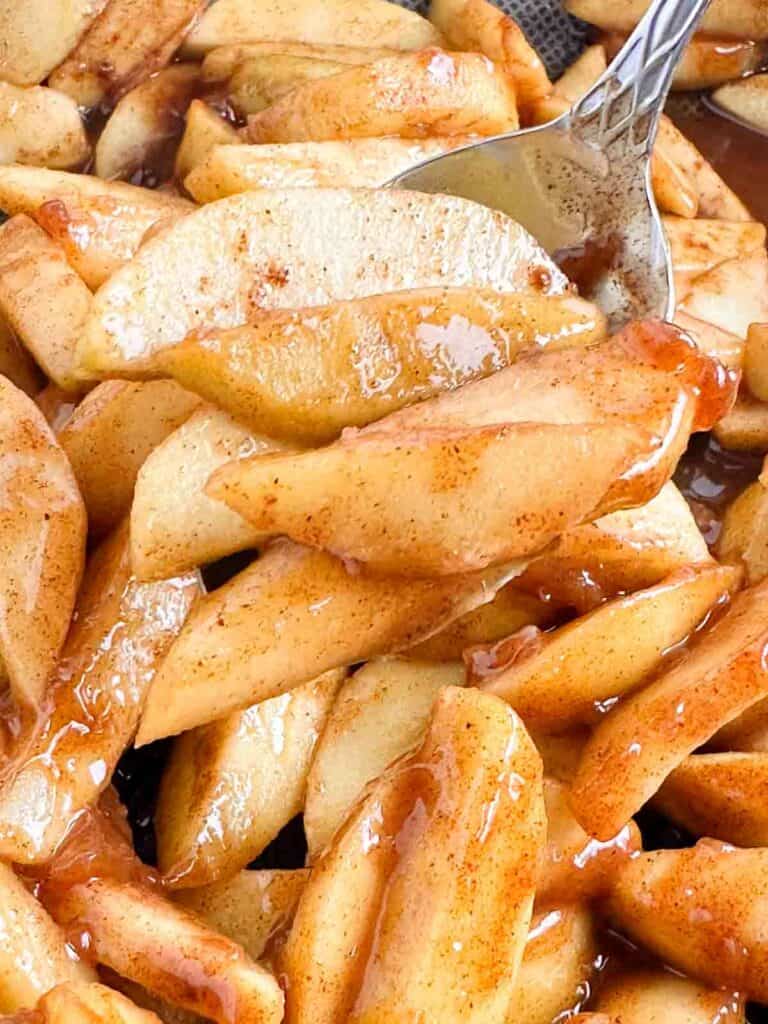 Spoon full of apple pie filling.