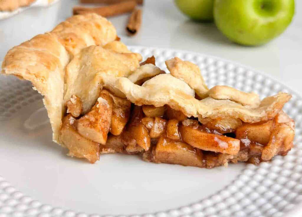 Fresh homemade apple pie with flaky crust and apple filling.