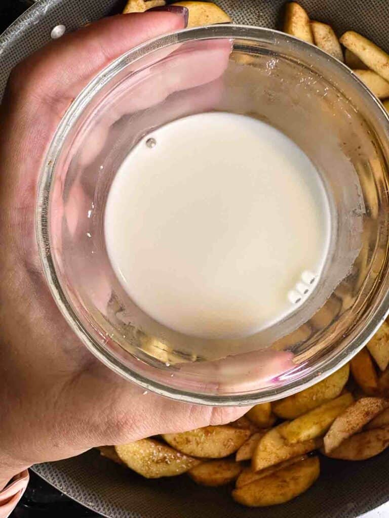 Corn starch and water slurry held over apple pie filling.
