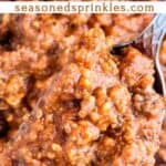 Homemade meat sauce lifted with a fork. Text reads: homemade meat sauce, seasonedsprinkles.com