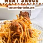 Homemade meat sauce lifted with a fork. Text reads: homemade meat sauce, seasonedsprinkles.com