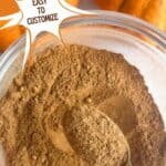 Homemade pumpkin pie spice in a bowl with a spoon. Text reads: pumpkin pie spice recipe, easy to customize, www.seasonedsprinkles.com