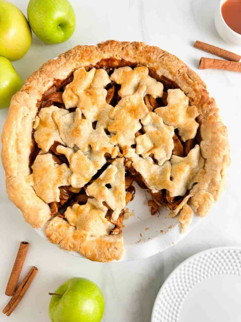 Apple pie with a slice cut out of it.