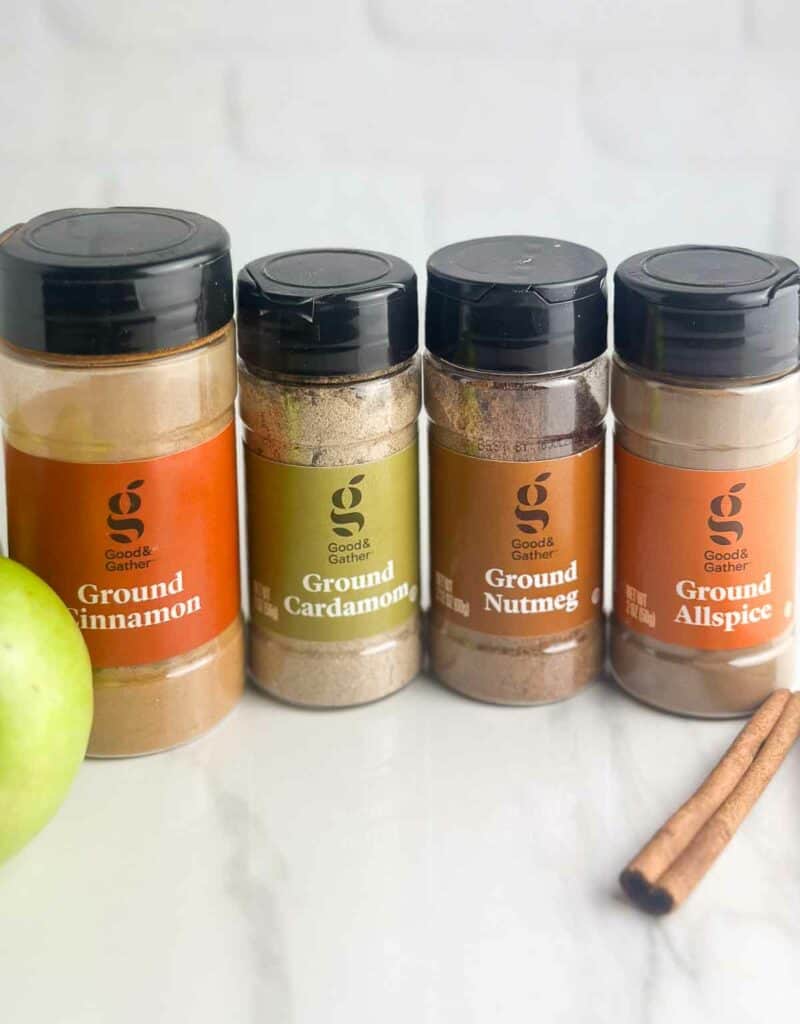 Ingredients for homemade apple pie spice recipe: ground cinnamon, ground cardamom, ground nutmeg, and ground all spice.