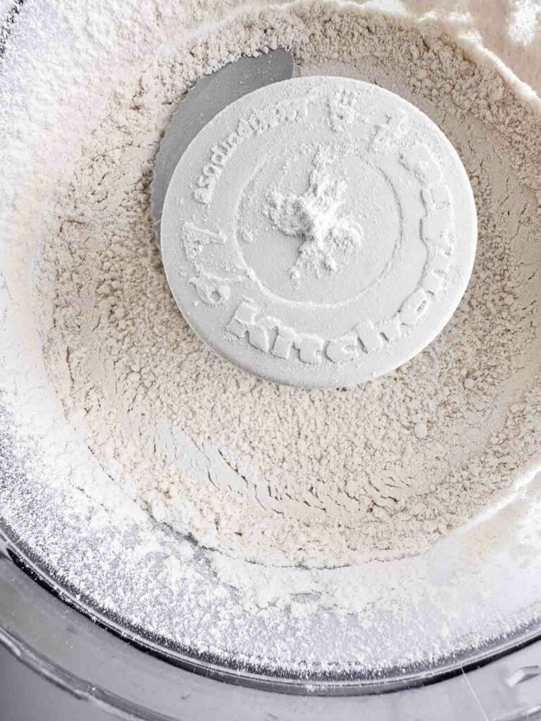 Flour pulsed in a food processor bowl.