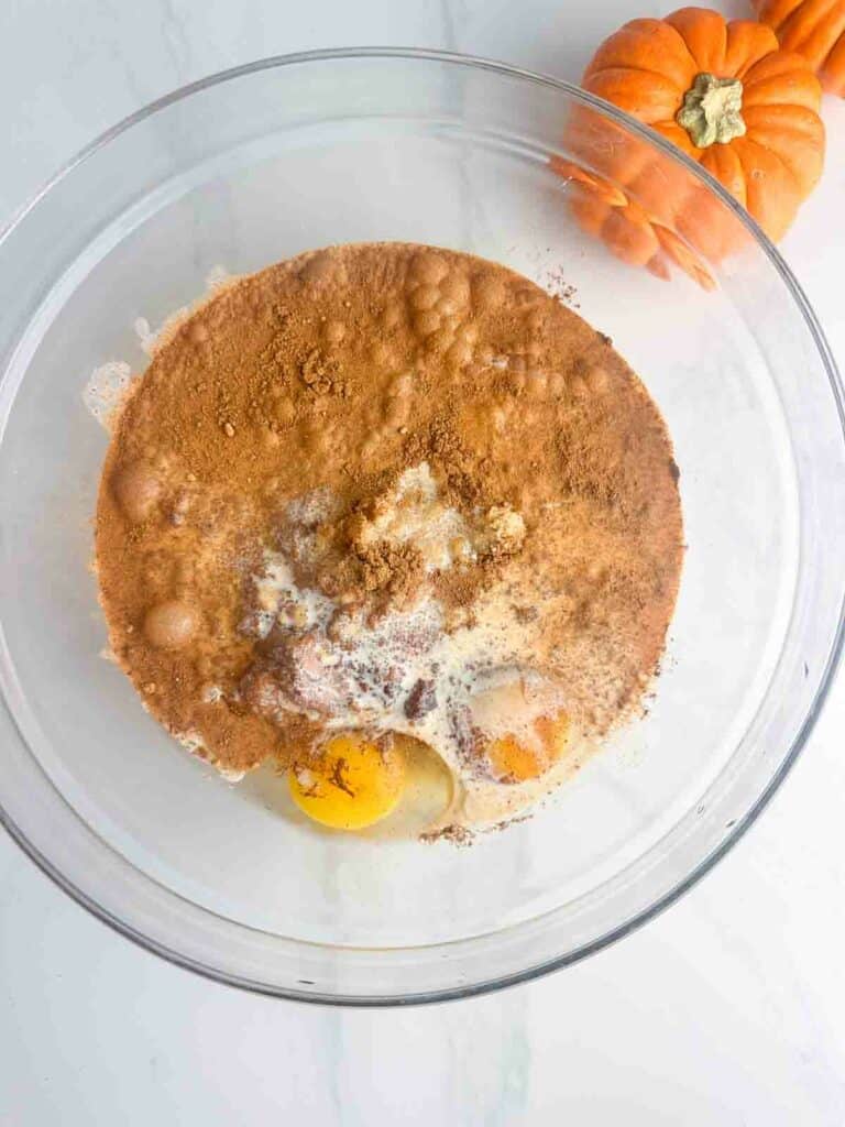 Combine the pumpkin puree, eggs, brown sugar, evaporated milk, and pumpkin pie spice in a mixing bowl