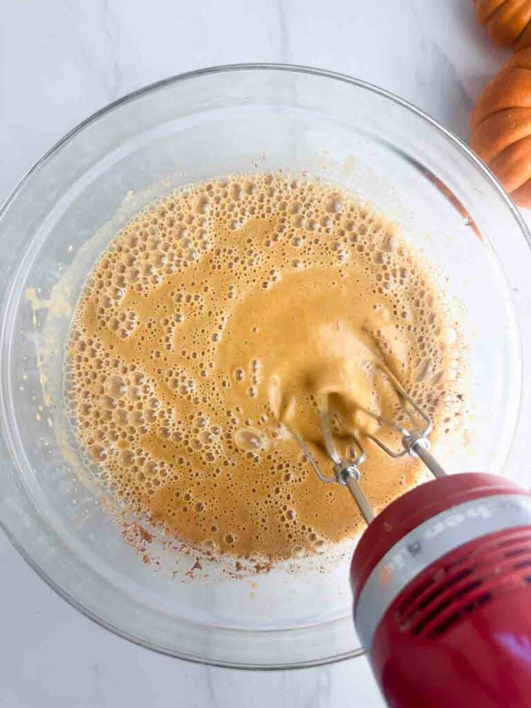 Mix the pumpkin puree, eggs, brown sugar, evaporated milk, and pumpkin pie spice in a mixing bowl with an electric mixer until smooth