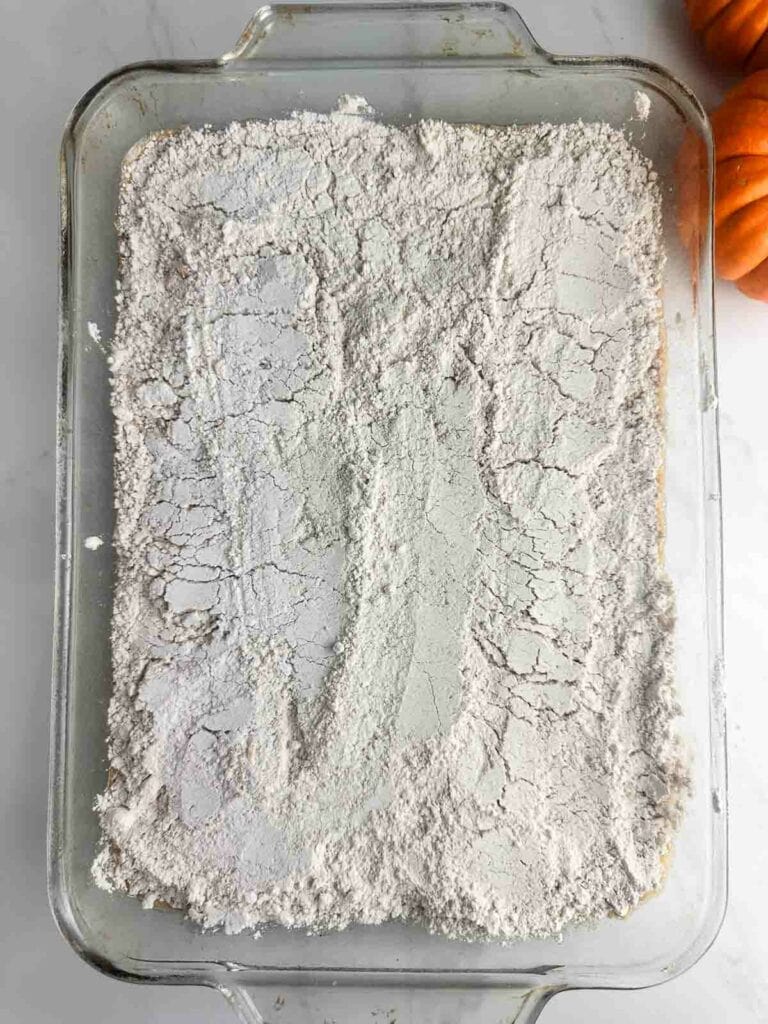 Top the pumpkin custard layer with the bag of spice cake mix