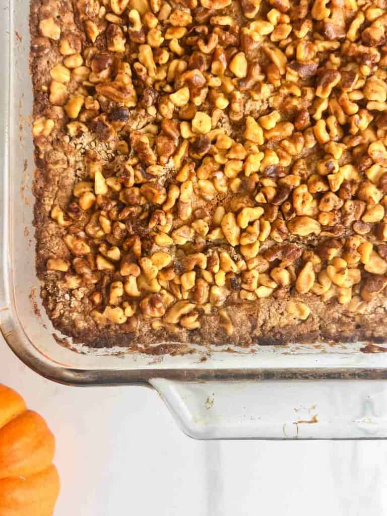 A close up of pumpkin praline cake in the casserole dish