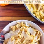 Pumpkin pasta being served and spun on a fork. Text reads: pumpkin pasta seasonedsprinkles.com