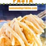 Pumpkin pasta being served and spun on a fork. Text reads: pumpkin pasta seasonedsprinkles.com