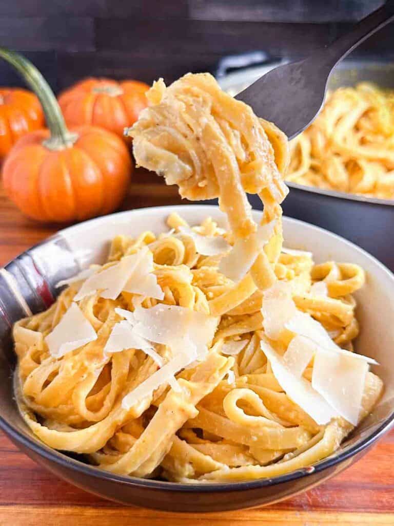 Getting a fork full of pumpkin pasta.