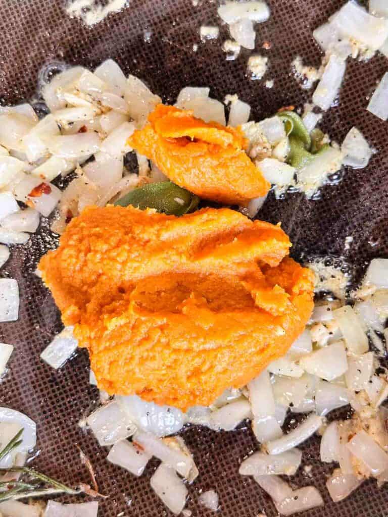 Pumpkin puree added to sauteed onions and garlic.