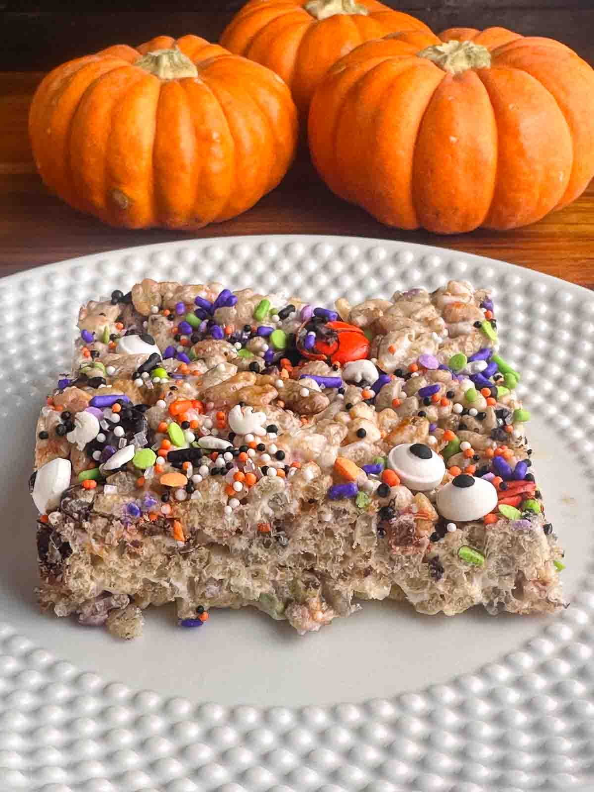 Halloween rice krispie treat on a white plate.