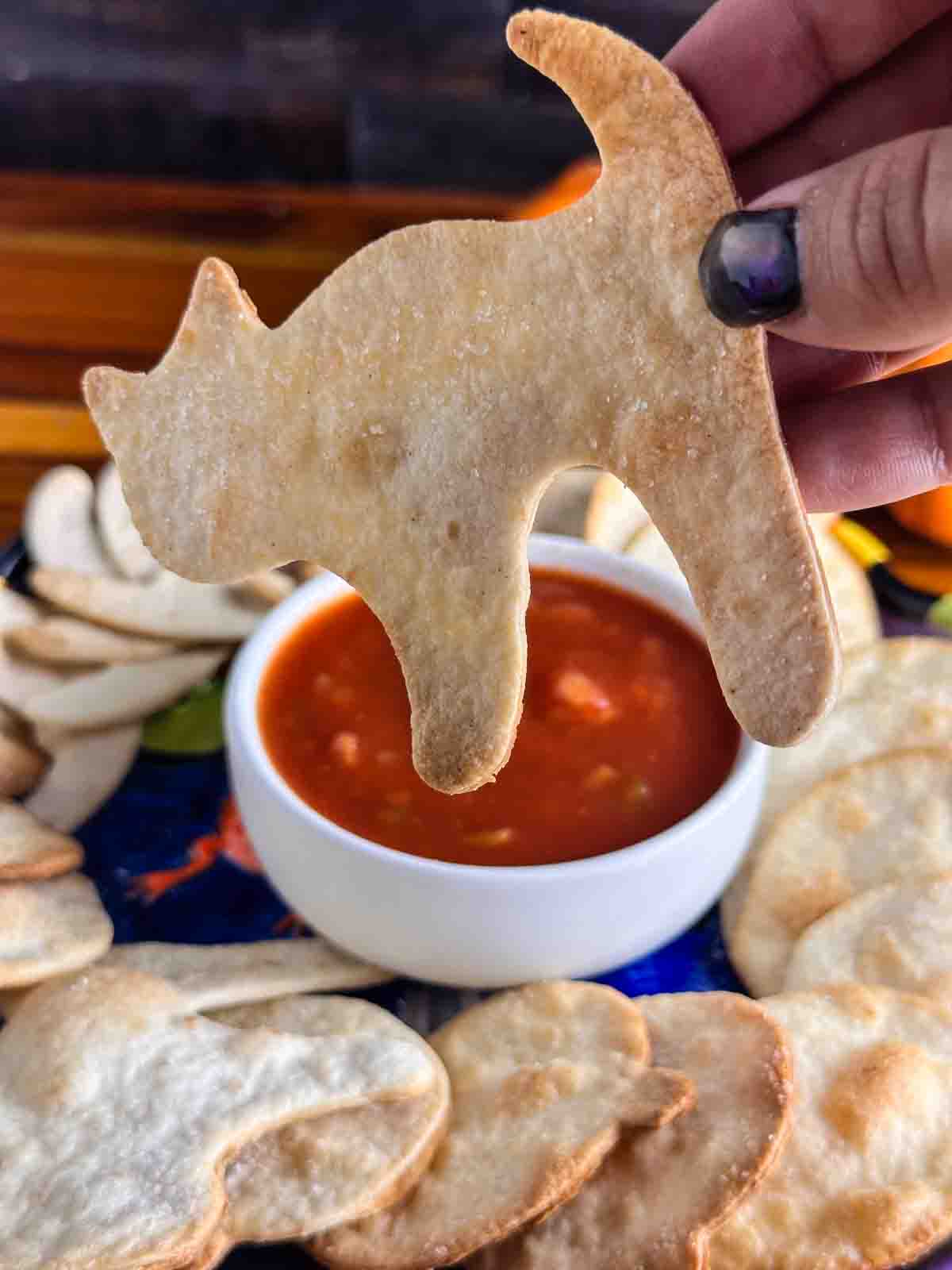 a black cat shaped Halloween tortilla chips