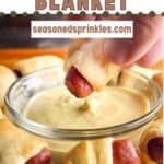Dipping a pig in a blanket into mustard. Text reads: pigs in a blanket, seasonedsprinkles.com.